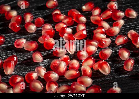 pomegranate seeds on wood background Stock Photo