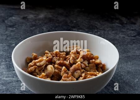 A  bowl of walnut halves. Stock Photo