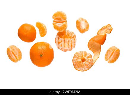 Flying sweet ripe mandarins on white background Stock Photo
