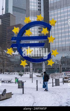 Winter in Frankfurt, Euro sculpture on Willy-Brandt-Platz, snow-covered, Hesse, Germany Stock Photo