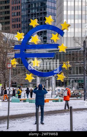 Winter in Frankfurt, Euro sculpture on Willy-Brandt-Platz, snow-covered, Hesse, Germany Stock Photo