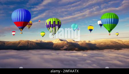 Hot air balloons flying over foggy mountains. Banner design Stock Photo