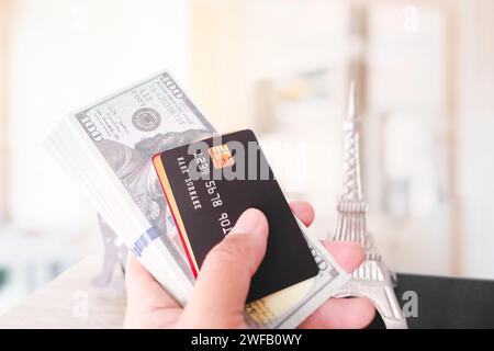 Close up of hand holding credit or debit card and dollar banknote mockup , Financial and travelling concept Stock Photo