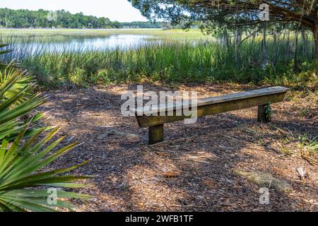 Trail bench along salt flats of the Skidaway Narrows at Skidaway Island State Park in Savannah, Georgia. (USA) Stock Photo