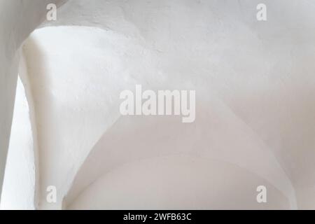 Interior of an old lighthouse. Whitewashed vaults. White background. Stock Photo