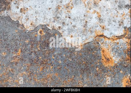 Texture of raised rust stains on the surface of a metal sheet. Stock Photo