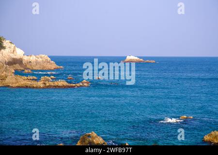 Samcheok City, South Korea - December 28, 2023: A view of the rugged and rocky coastline of the East Sea at Haesindang Park, with the historic outcrop Stock Photo