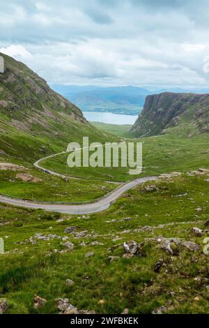 Driving the Bealach na Ba single track scenic road from Applecross. View from the pass in North West Highlands, Scotland, UK Stock Photo