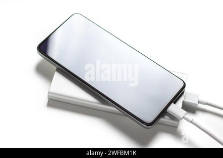 Smartphone charger with powerbank on white background. Stock Photo