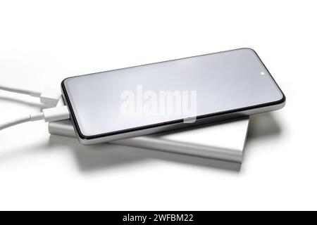 Smartphone charger with powerbank on white background. Stock Photo