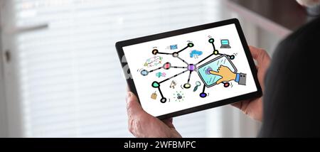 Social network concept shown on a tablet held by a man Stock Photo