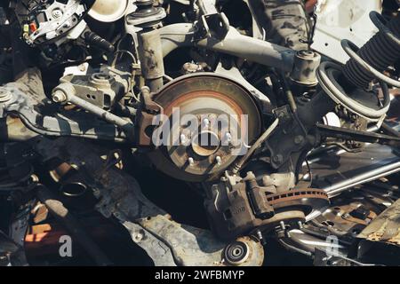 Wheel hubs laid out as scrap metal at a junkyard Stock Photo