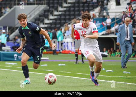 Doha, Qatar. 18th Jan, 2024. Jordan Bos of Australia and Ammar Ramadan of Syria during the AFC Asian Cup Qatar 2023, Group B football match between Syria and Australia on January 18, 2024 at Jassim bin Hamad Stadium in Doha, Qatar - Photo Najeeb Almahboobi/TheMiddleFrame/DPPI Credit: DPPI Media/Alamy Live News Stock Photo