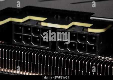 2 ports of 8 pins of power supply of the video card together with a cooling radiator close-up. Stock Photo