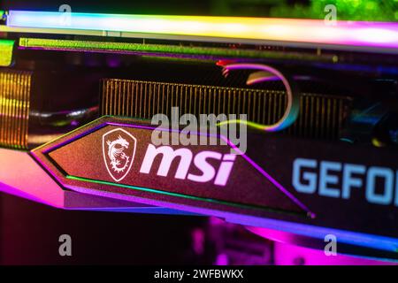 Dnipro, Ukraine - February 23, 2023: MSI Geforce RTX gaming graphics card in a open case with glow. Stock Photo