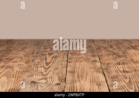 empty wooden table float up on beige background. Stock Photo