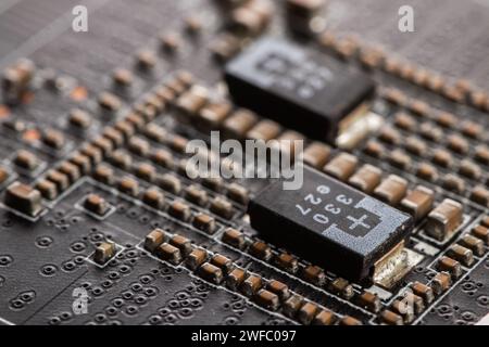 Detail of electronic components and microchips on a video card. Latest generation Video Card Stock Photo