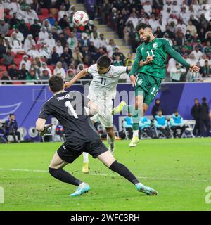 Doha, Qatar. 21st Jan, 2024. Saleh Al-Shehri of Saudi Arabia and Bekzhan Sagynbaev, goalkeeper Erzhan Tokotaev of Kyrgyz Republic during the AFC Asian Cup Qatar 2023, Group F football match between Kyrgyz Republic (Kyrgyzstan) and Saudi Arabia on January 21, 2024 at Ahmed Bin Ali Stadium in Doha, Qatar - Photo Najeeb Almahboobi/TheMiddleFrame/DPPI Credit: DPPI Media/Alamy Live News Stock Photo