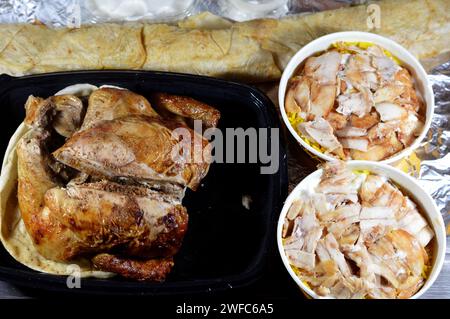 Cairo, Egypt, January 22 2024: Karam El Sham Syrian food of grilled barbecued chicken, Long dragon Syrian chicken shawerma or shawarma tortilla wrap a Stock Photo