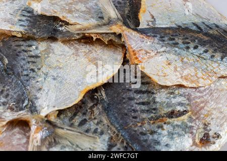 Dried yellowstripe scad fishes. snack for beer. Stock Photo