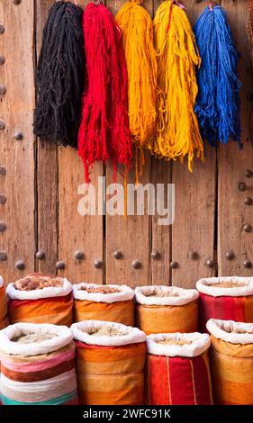 North Africa Morocco Marrakech Marrakesh medina the wool dyers traditional market place with colourful herbs spices in bags sacks the souk markets Stock Photo