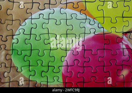 Jigsaw puzzle closeup view showing puzzle pieces in position Stock Photo