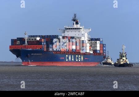Buffeted by 20mph winds Svitzer tugs bring container ship CMA CGM ...