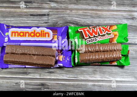 Cairo, Egypt, January 25 2024: Mandolin Biscuit Covered with Caramel and Chocolate, Cadbury Mandolin bars and new Twix Choco-Hazelnut caramel shortbre Stock Photo