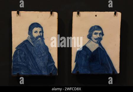 Amsterdam, Netherlands. January 20, 2024. Two antique Delft Blue tiles isolated on black background. High quality photo Stock Photo