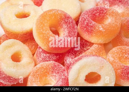 Gummy rings with sugar background. Close up. Stock Photo