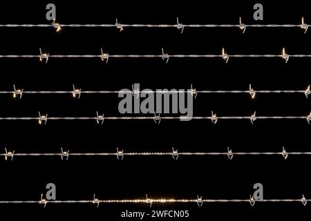 Barbed wire and fence, front view of a wire mesh, black and white. Protection, private place, no access. Prisoners, protected area. 3d rendering Stock Photo