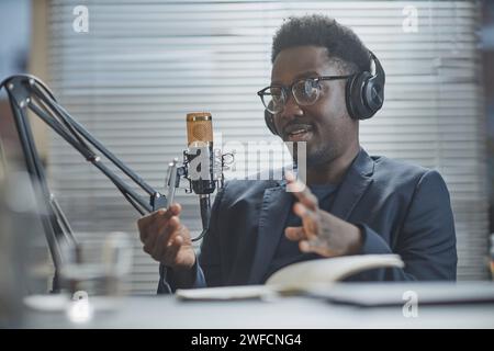 Confident Man Giving Speech during Podcast Stock Photo