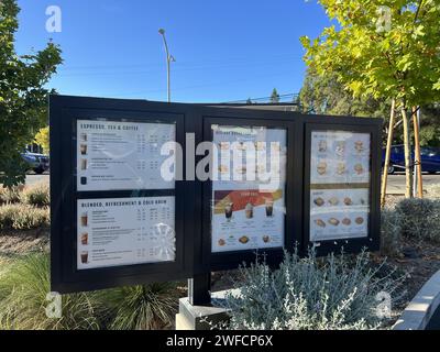 Drive-through menu boards displaying a variety of espresso, tea, coffee, and food options at a Starbucks cafe in Walnut Creek, California, October 15, 2023. Stock Photo
