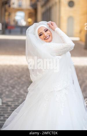 Beautiful Muslim bride outdoors Stock Photo