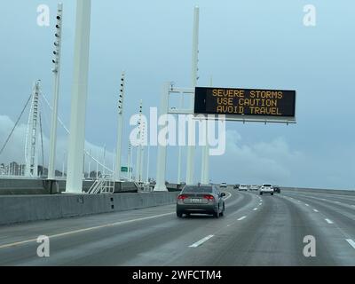 A sign on the Oakland San Francisco Bay Bridge warns of severe storms during a rain storm in Oakland, California, January 15, 2023. Stock Photo