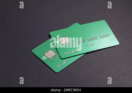Two green credit cards on dark background Stock Photo