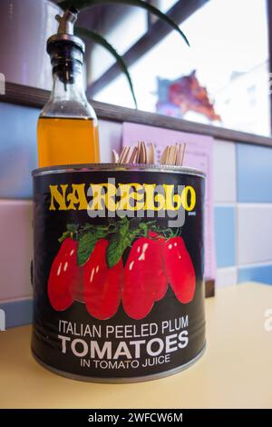 Close up of a Narello Italian Plumed Peeled Tomatoes in Tomato Juice tin can in a pizza restaurant Stock Photo