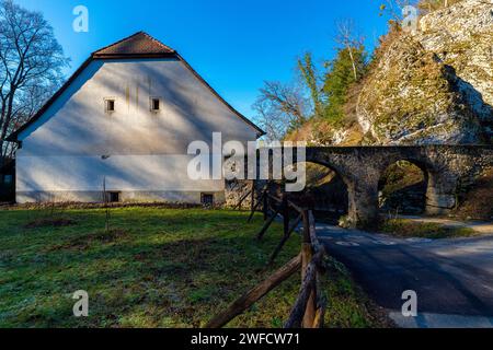 The water mill building was built in 1780 and aqueduct, became a part of the Ermitage in 1814.  The aqueduct leads the water to both mills and then ta Stock Photo