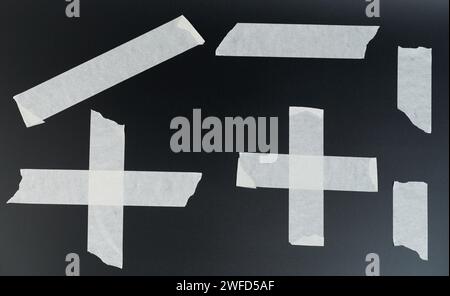 White paper msaking tape set with crumple edge isolated on black studio background Stock Photo