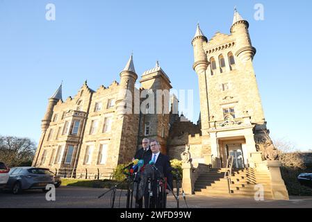 DUP leader Sir Jeffrey Donaldson MP (right) and party colleague Gavin Robinson MP speak to the media at the Parliament Buildings in Stormont, Belfast. Powersharing in Northern Ireland is set to return after the DUP party executive backed a government deal aimed at addressing its concerns over post-Brexit trade barriers. Picture date: Tuesday January 30, 2024. Stock Photo