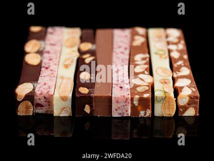 Set of different chocolate bars on black background Stock Photo