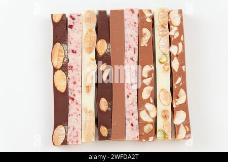 Set of different chocolate bars on white background, shot from above Stock Photo