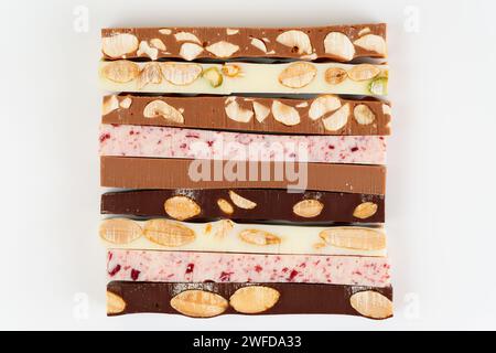 Set of different chocolate bars on white background, shot from above Stock Photo