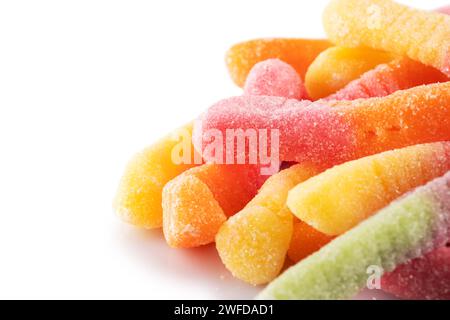 Colorful jelly worms in sugar isolated on a white background. Gummy candies. Snakes Stock Photo