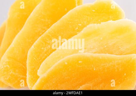 Sliced dried mango isolated on white background. Stock Photo