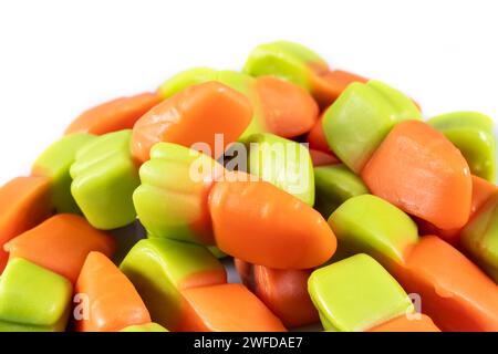 jelly carrots candies on a white background. Colorful fruit gum candies Stock Photo