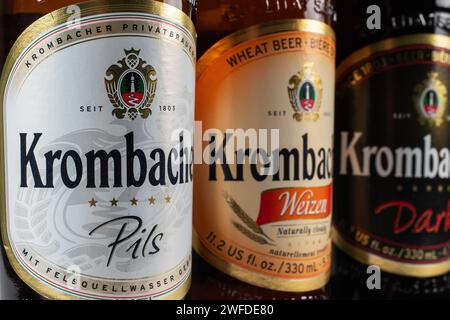 Dnipro, Ukraine, 18 oct, 2023: Variety of Krombacher Weizen Pils Dark beer. Krombacher brewery was founded in 1803 in Germany. Stock Photo