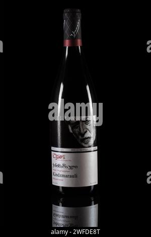 Dnipro, Ukraine, 18 oct, 2023: Bottle of red wine Kindzmarauli, Corporation Kindzmarauli, Georgia 2021 on black background. Stock Photo