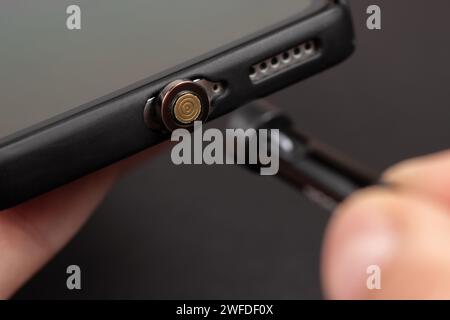 Magnetic cable for charging smartphone, close up Stock Photo