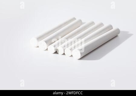 white chalk sticks isolated on white background Stock Photo